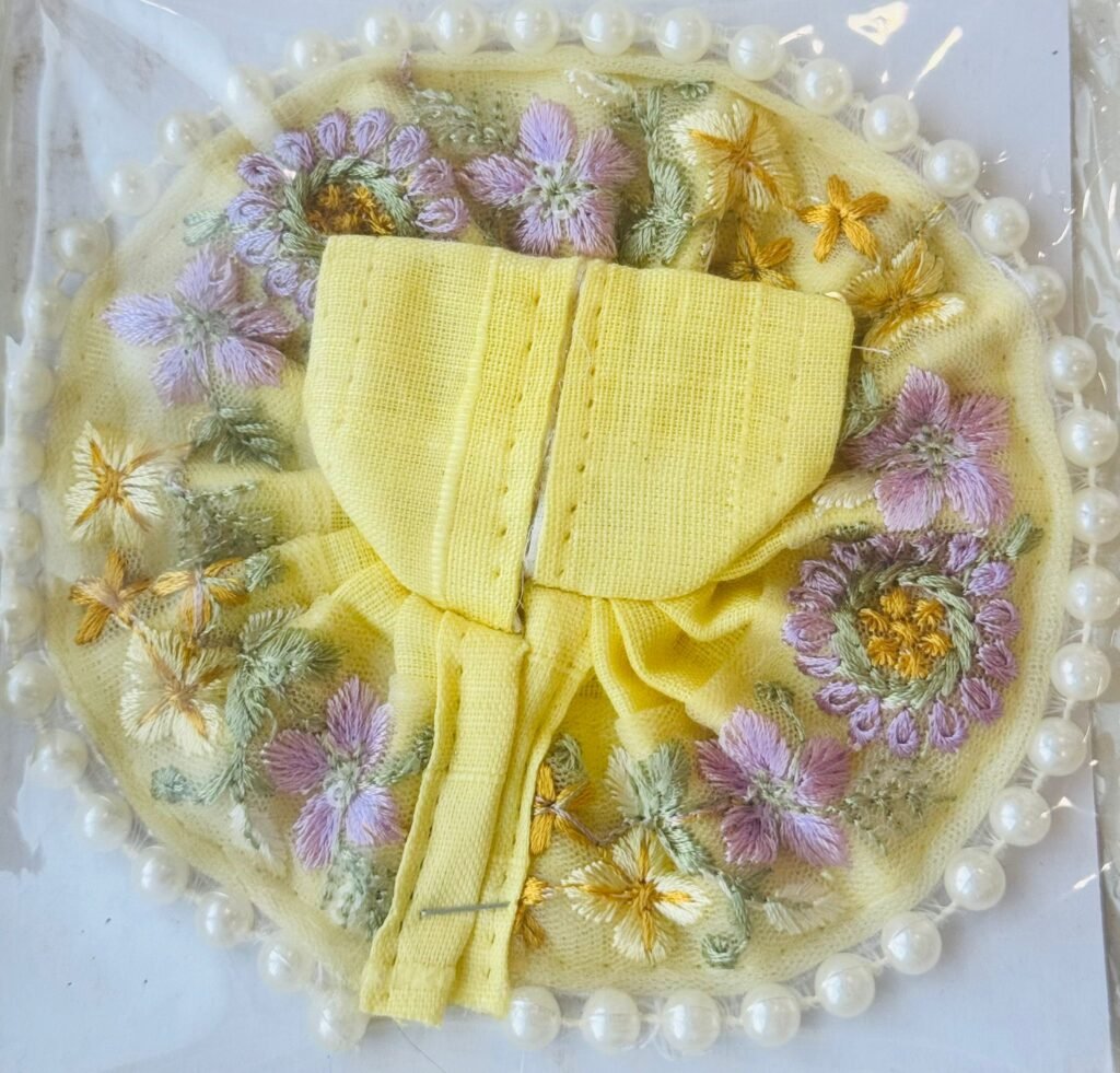 Pastel yellow Laddu Gopal dress with soft floral embroidery and pearl border