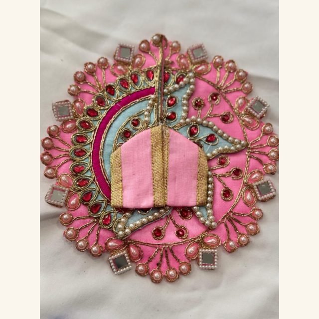 Pink Ladoo Gopal dress in Size 2 with red stones, pearl lace, golden embroidery, mirror accents, and a pastel blue arc design.