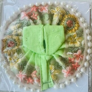 Pastel green Laddu Gopal dress with soft floral embroidery in pink, yellow, and white, finished with a pearl border