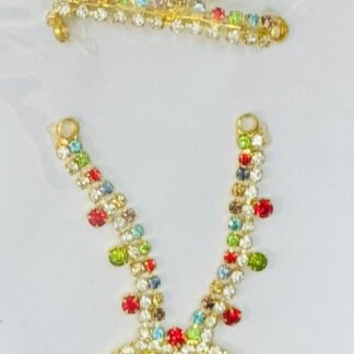 Laddu Gopal accessory set with vibrant multicolor stones on a golden base, including a mukut, mala, and matching earrings