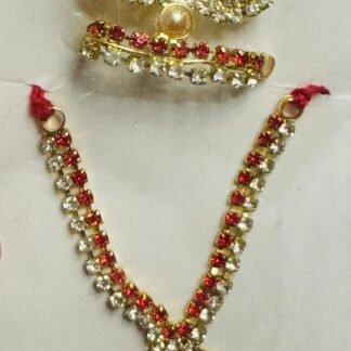 Laddu Gopal accessory set with red and white stones, gold-tone floral mukut, necklace, and matching earrings