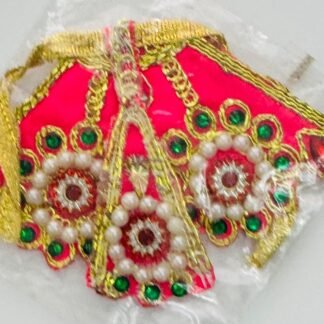 Hot pink Radha Rani dress with circular white pearl and green stone embellishments, gold thread detailing, packed in a transparent wrapper.