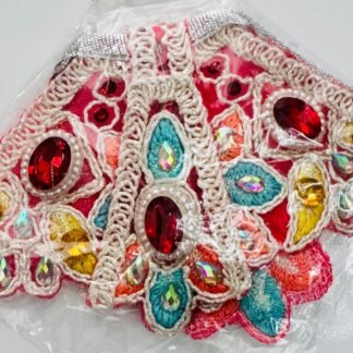 Multicolored Radha Rani dress with intricate floral embroidery, red and yellow gemstones, and crystal embellishments, wrapped in clear plastic.