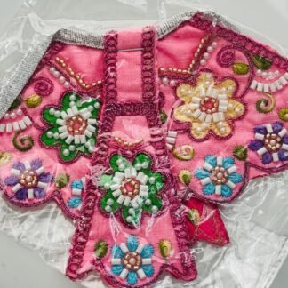 A rich combination of purple, coral, and multicolor velvet detailing, enhanced with faux pearls, gemstones, and glitter threadwork. An eye-catching attire perfect for divine celebrations.