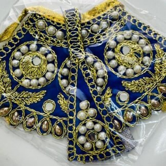 A royal blue Radha Rani dress adorned with golden embroidery, white pearls, and teardrop-shaped embellishments.