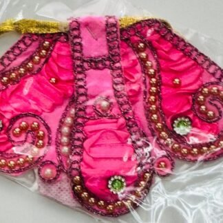 Bright pink velvet Radha Rani dress with paisley pearl beadwork and green stone accents