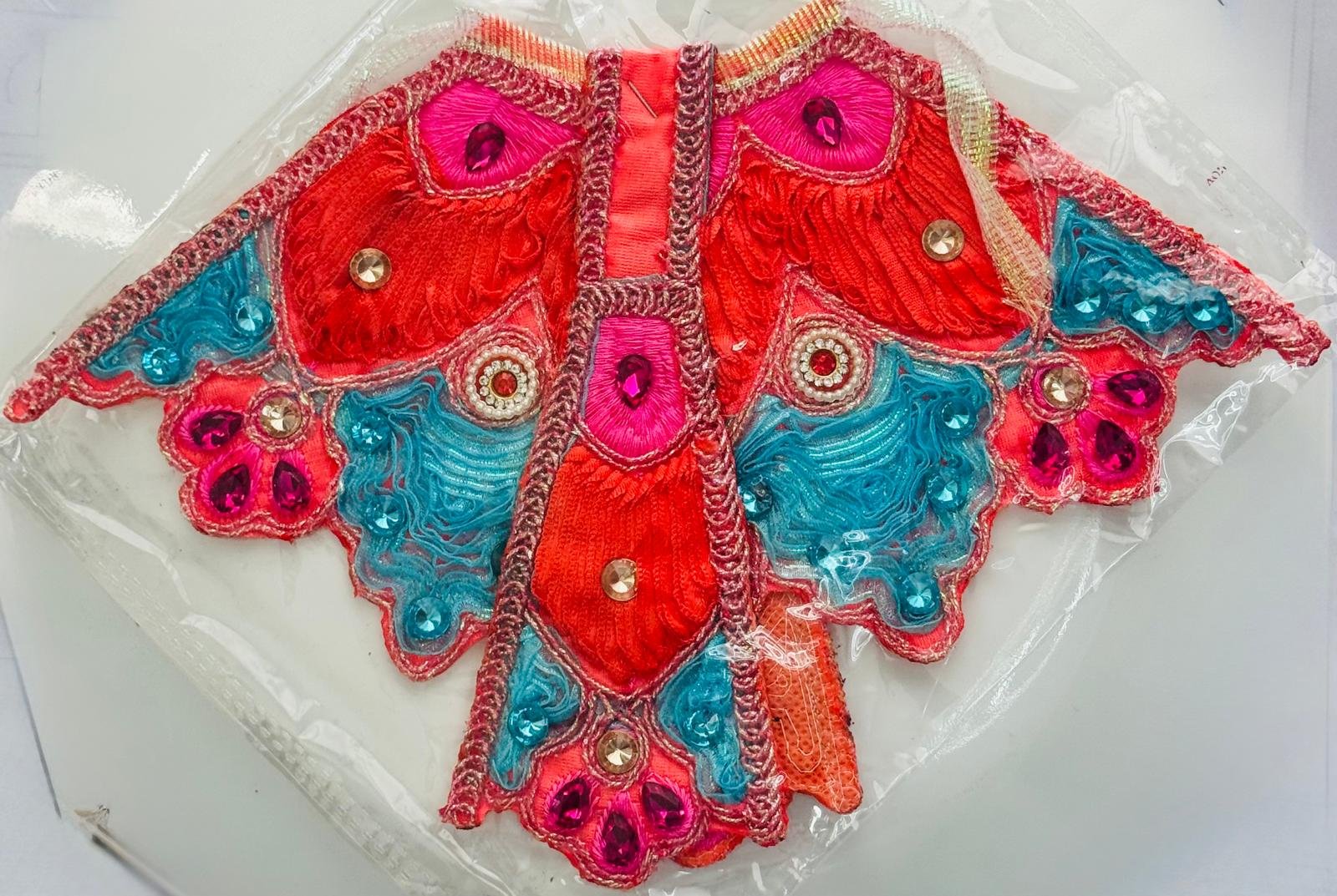 Radha Rani Lehenga with butterfly-style red, pink, and blue embroidery and stone embellishments